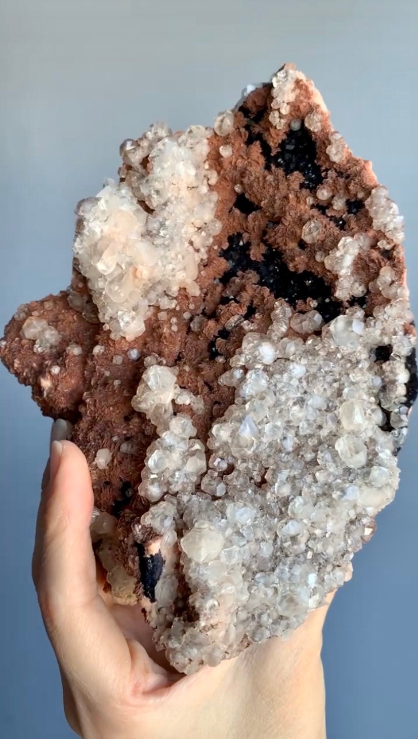 Lustrous Calcite with dark purple fluorite