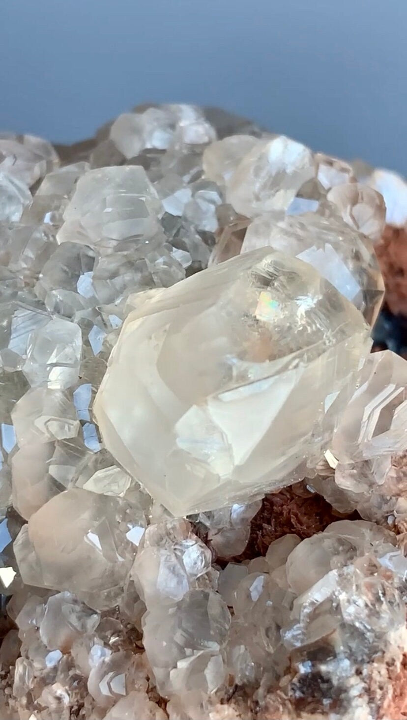 Lustrous Calcite with dark purple fluorite