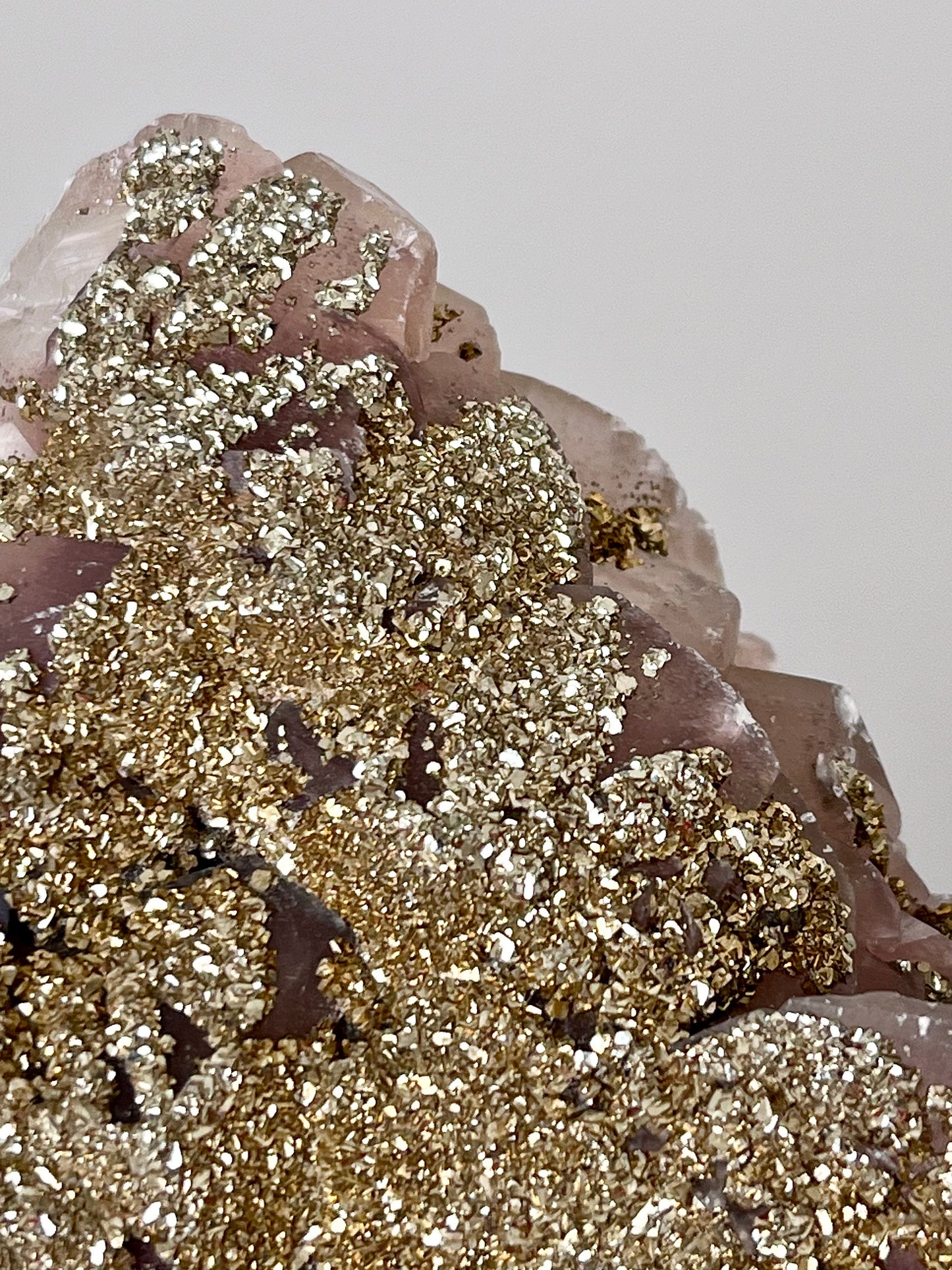 Fluorescent Pyrite-coated Calcite