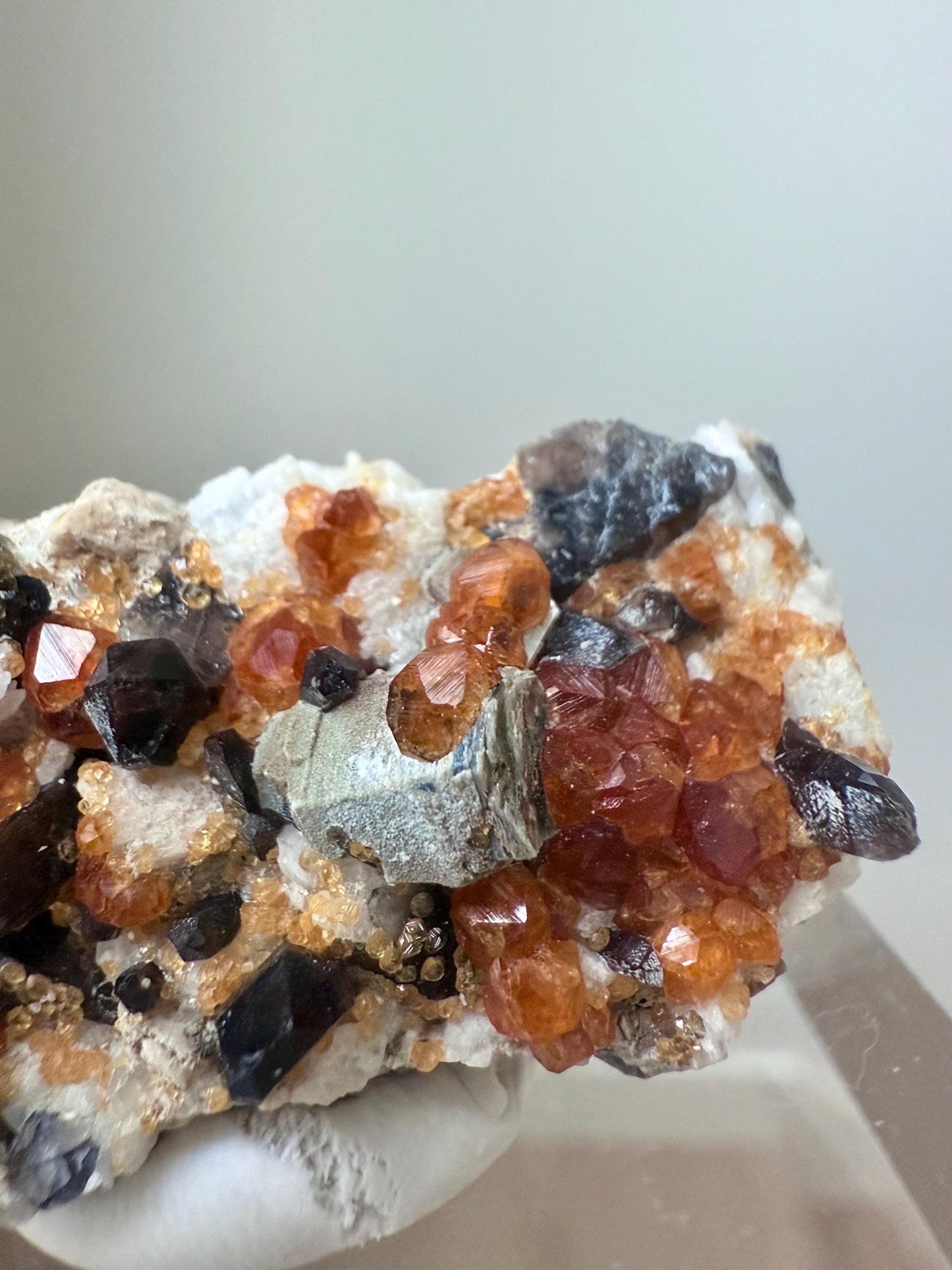 Smoky Quartz with Fanta Spessartine Garnets on Feldspar