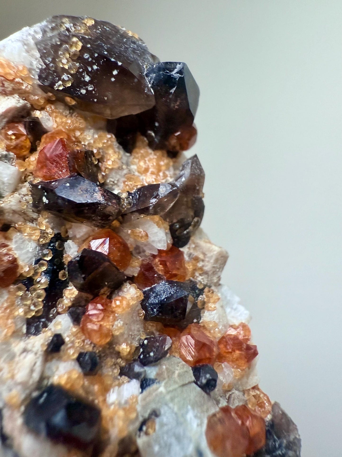 Smoky Quartz with Fanta Spessartine Garnets on Feldspar