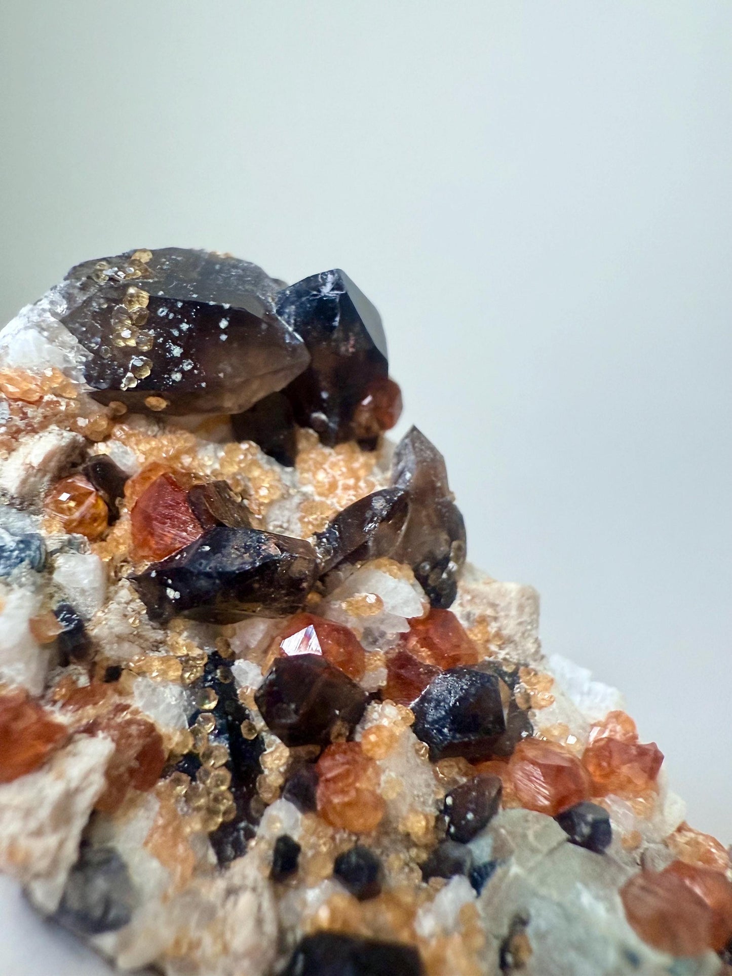 Smoky Quartz with Fanta Spessartine Garnets on Feldspar